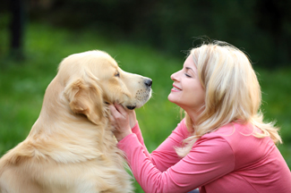 Woman and Dog in Green Yard